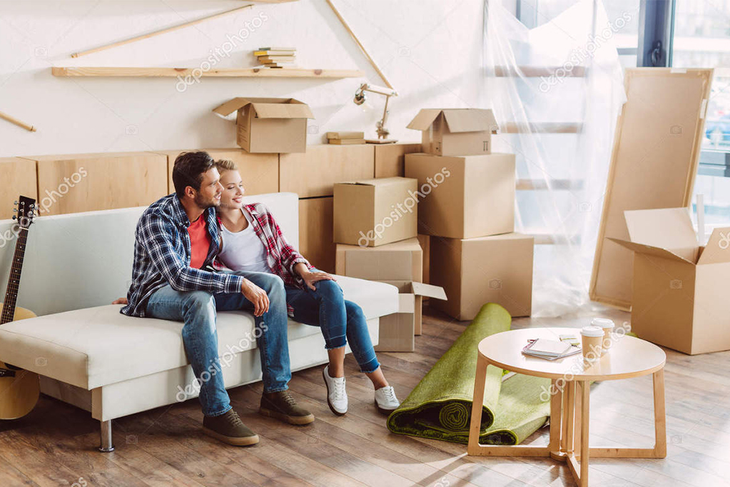 Couple resting in new house